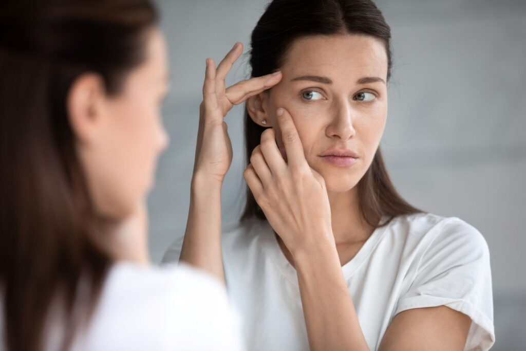 A woman looking in the mirror