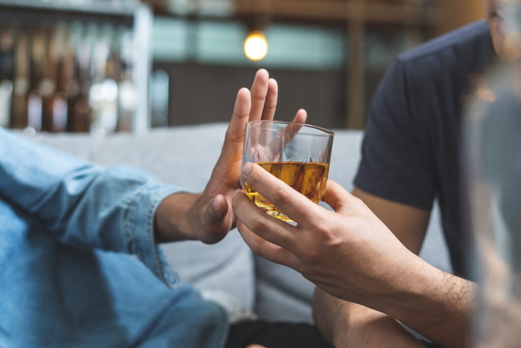 Hand turning down an alcoholic drink
